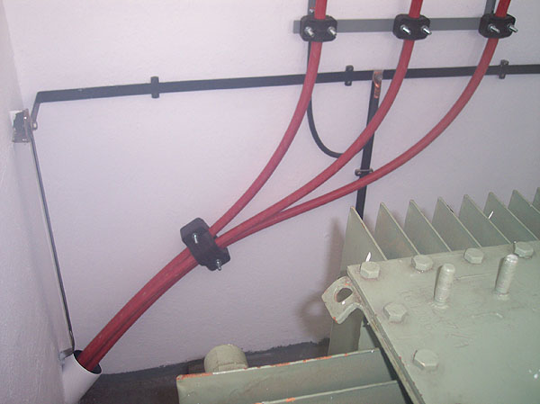 Bracket and piping for transformer bridges